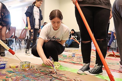 Girls from École Secondaire Neelin High School and Prairie Hope High School paint to different types of music to see how the different music alters their artistic style during an International Day of the Girl event at the Art Gallery of Southwestern Manitoba on Wednesday. (Tim Smith/The Brandon Sun)