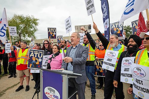 RUTH BONNEVILLE / WINNIPEG FREE PRESS

LOCAL - transit picket

Chris Scott, Union President of The Amalgamated Transit Union local 1505 holds an information picket in front of the Fort Rouge Garage with many union members walking the picket line to &quot;practice&quot; their stance on talks, Wednesday. 

&#x201c;The rally serves as a demonstration of the union&#x2019;s resolve to secure fair wages and uphold working conditions that prioritize the well-being of transit workers. Despite nine months of negotiations, conciliation between ATU Local 1505 and the employer has reached an impasse, leaving no mutually agreeable terms to present to the membership for a vote.&#x201d;  (Quote from the assignment on sched)

October 11th, 2023