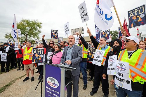 RUTH BONNEVILLE / WINNIPEG FREE PRESS

LOCAL - transit picket

Chris Scott, Union President of The Amalgamated Transit Union local 1505 holds an information picket in front of the Fort Rouge Garage with many union members walking the picket line to &quot;practice&quot; their stance on talks, Wednesday. 

&#x494;he rally serves as a demonstration of the union&#x573; resolve to secure fair wages and uphold working conditions that prioritize the well-being of transit workers. Despite nine months of negotiations, conciliation between ATU Local 1505 and the employer has reached an impasse, leaving no mutually agreeable terms to present to the membership for a vote.&#x4e0; (Quote from the assignment on sched)

October 11th, 2023