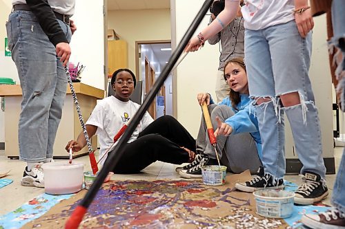 11102023
Girls from &#xc9;cole Secondaire Neelin High School and Prairie Hope High School paint to different types of music to see how the different music alters their artistic style during an International Day of the Girl event at the Art Gallery of Southwestern Manitoba on Wednesday.   
(Tim Smith/The Brandon Sun)