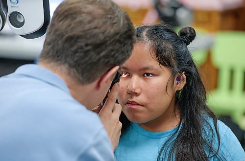 RUTH BONNEVILLE / WINNIPEG FREE PRESS
 
LOCAL - mobile eye clinic

Eleven-year-old Duclie who attends Fort Rouge School, get her eyes checked by Dr. Stephen Mazur at the Mobile Eye Clinic that visited their school Tuesday. 

SCHOOL EYE CLINICS: Mobile Vision Care Clinic &#x460;an on-the-go optometry team that visits schools to check students' eyes &#x460;has expanded operations this year following the injection of provincial funds. Since the start of the year, the clinic, which partners with school divisions, has been visiting city schools, in addition to rural sites with new funding. 

October 10th, 2023