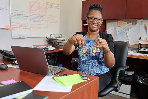 BRNC executive director Rushana Newman showcased a set of earings made by one of the homeless artists. (Abiola Odutola/The Brandon Sun)