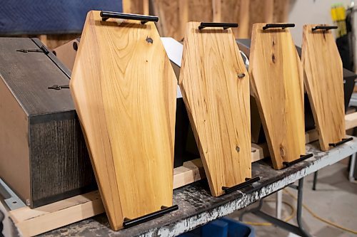 BROOK JONES / WINNIPEG FREE PRESS
Blake Locken, who works as a carpenter by day, runs a home-based business called Old Pine Box Curiousitiies. Pictured: Charcuterie boards made by Locken in his garage in Winnipeg, Man., Wednesday, Oct. 11. Locken also builds pet beds, cabinets, book shelves, coffee tables and wine racks. The Winnipeg resident will be a vendor at the Punk Rock Flea Market at the University of Manitoba in Winnipeg, Man., Saturday, Oct. 14, 2023 from 10:30 a.m. to 5 p.m. The event also run Sunday, Oct. 15, 2023.