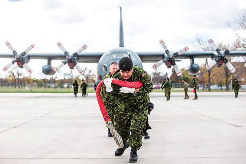 MIKAELA MACKENZIE / WINNIPEG FREE PRESS

Dylan Meekis leads the MSS Warriors team as they pull the Herc in a plane pull event in support of United Way Winnipeg held at 17 Wing Winnipeg on Friday, Oct. 13, 2023. Standup.
Winnipeg Free Press 2023.