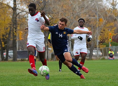 Brandon's Julien Dizengremel, right, challenges USB's Ismaila Ndoye for the ball during the MCAC men's soccer action at the Healthy Living Centre field on Saturday. (Thomas Friesen/The Brandon Sun)