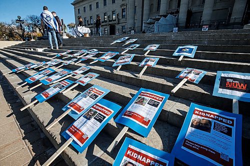 JOHN WOODS / WINNIPEG FREE PRESS
Signs are placed on the steps as about 200 Israel supporters gathered to support the war with Palestine at the Manitoba Legislature in Winnipeg Sunday, October 15, 2023. 

Reporter: searle