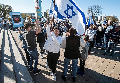 JOHN WOODS / WINNIPEG FREE PRESS
Israel supporters sing and dance as they gathered to support the war with Palestine at the Manitoba Legislature in Winnipeg Sunday, October 15, 2023. 

Reporter: searle