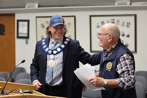Don Partrick (right) of the Rotary Club of Brandon presents Mayor Jeff Fawcett (left) with a hat after promoting the organization’s efforts to help in the fight against polio. Rotary Clubs around the world will be commemorating World Polio Day on Oct. 24 as they continue to promote vaccination against the virus, which can cause paralysis. (Colin Slark/The Brandon Sun)
