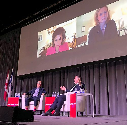 JOHN LONGHURST / WINNIPEG FREE PRESS

Michael Levitt, president and CEO of Friends of Simon Wiesenthal Center (l) with Jason Kenney, former Premier of Alberta. On the screen are Farah Pandith, senior advisor at the Anti-Defamation League (l) and Katharina von Schnurbein, European Commission coordinator on Combating Antisemitism and Fostering Jewish Life. 