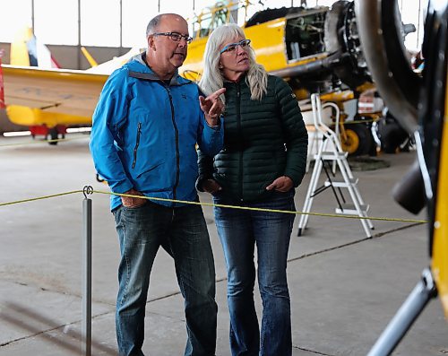 Jeff Mann and Ruth Jellicoe from Alberta admiring the planes on display at the Commonwealth Air Training Plan Museum (CATPM) in Brandon on Tuesday. (Michele McDougall/The Brandon Sun)