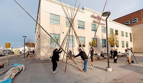 MIKE DEAL / WINNIPEG FREE PRESS
Volunteers put up a teepee outside Siloam Mission at the start of the day long Gizhe Waa Tii-Si-Win Expo.
The Gizhe Waa Tii-Si-Win Expo is a volunteer-driven, community-based initiative. At the Expo, service providers come together across sectors, on one day and in one place, to deliver essential, dignity-enhancing services for people experiencing or at risk of homelessness, for free. The event&#x2019;s name means &#x201c;working with love, kindness and generosity for others&#x201d; in Anishinaabemowin.
See Tyler Searle story
231017 - Tuesday, October 17, 2023.