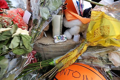 A rock painted with the word &quot;love&quot; is part of a Victoria Avenue memorial to 15-year-old Antoine Sutherland, who was killed in a bike-vehicle collision at the same Victoria Avenue crosswalk. The memorial is made of flowers, photos, stuffed animals and other items as a remembrance of the Vincent Massey High School student. (Matt Goerzen/The Brandon Sun)