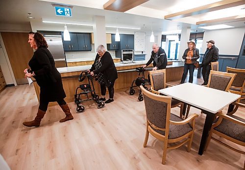 JOHN WOODS / WINNIPEG FREE PRESS
Frieda Enns, leasing agent for Edison Properties, left, leads a tour of a memory care cottage at the opening of Bergen Gardens, a long-term care facility in Winnipeg Tuesday, October 17, 2023. 

Reporter: gabby