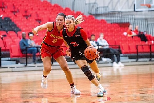 MIKAELA MACKENZIE / WINNIPEG FREE PRESS

Wesmen Anna Kernaghan dribbles (3) as Dino Mya Proctor (0) blocks during an inter squad basketball game at the Duckworth Centre on Friday, Sept. 22, 2023. For Taylor Allen story.
Winnipeg Free Press 2023