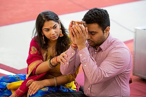 BROOK JONES / WINNIPEG FREE PRESS
Members of the Hindu community gather on the fourth day of the Sharadiya Navratri Festival, which celebrates the nine forms of the Hindu Goddess Durga at the Hindu Temple and Dr. Raj Pandey Cultrual Centre in Winnipeg, Man., Wednesday, Oct. 18, 2023. Pictured: Anand Amin (right) and Shivani Patel performing Lakshmi Mata Puja, which is also known as praying to and worshipping the Goddess Durga. Amin and Patel are sitting in front of the altar.