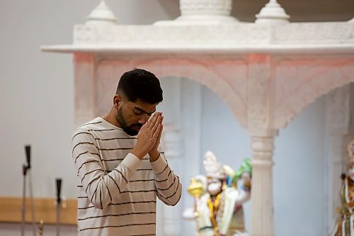 BROOK JONES / WINNIPEG FREE PRESS
Members of the Hindu community gather on the fourth day of the Sharadiya Navratri Festival, which celebrates the nine forms of the Hindu Goddess Durga at the Hindu Temple and Dr. Raj Pandey Cultrual Centre in Winnipeg, Man., Wednesday, Oct. 18, 2023. Pictured: Winnipeg resident Nikhio Patel praying to the Goddess Durga, who is in the form of Kushmanda on the fourth day of the festival, in front of the altar.