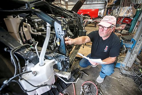 Johnny Vernaus, president of Vernaus Auto Body, with a frame damaged vehicle covered by MPI in his shop on Higgins in Winnipeg on Aug. 27. Vernaus feels body shops like his will go from doing 30 per cent of estimates to 80-90 per cent during the strike. (John Woods/Winnipeg Free Press)

Re: ?