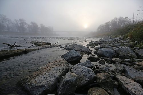 The banks of the Assiniboine River shimmer in the fog of a moody Manitoba morning in Brandon on Thursday. (Matt Goerzen/The Brandon Sun)