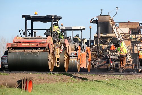 A parade of construction and packing vehicles line the eastbound land of the Trans-Canada Highway as part of $5.75 million in surface upgrades to a 2.2-kilometre stretch of the twinned roadway through Brandon, announced last year. (Matt Goerzen/The Brandon Sun)