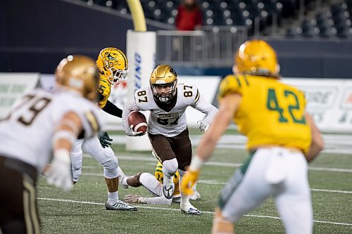 BROOK JONES / WINNIPEG FREE PRESS
The University of Manitoba Bison host the University of Alberta Golden Bears in Canada West football at IG Field in Winnipeg, Man., Friday, Oct. 20, 2023. Pictured: U of M Bisons receiver Michael O'Shea Jr., runs with the football during first quarter action. The Golden Bears earned a 35 to 25 victory over the Bisons.