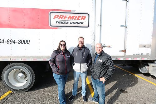 L-R: Premier Truck Group of Brandon Service Advisor Stephanie Sansom; Branch manager Dwayne Stone; Sales Representative Rois McEwen at the 3rd Annual Fill The Freightliner on Saturday in Brandon (Abiola Odutola/The Brandon Sun)