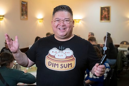 BROOK JONES / WINNIPEG FREE PRESS
Forty-one-year-old Carter Chen showing his enthusiams for the Chinatown Dim Sum Tour he is leading in Winnipeg, Man., on the afternoon of Saturday, Oct. 21, 2023. Chen, who has his very own Dim Sum T-shirt, is pictured at Dim Garden at 245 King St., which was one of two stops on the tour. The other location was Sam Po Restaurant at 277 Rupert Ave.