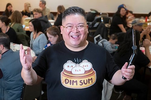 BROOK JONES / WINNIPEG FREE PRESS
Forty-one-year-old Carter Chen showing his enthusiams for the Chinatown Dim Sum Tour he is leading in Winnipeg, Man., on the afternoon of Saturday, Oct. 21, 2023. Chen, who has his very own Dim Sum T-shirt, is pictured at Dim Garden at 245 King St., which was one of two stops on the tour. The other location was Sam Po Restaurant at 277 Rupert Ave.