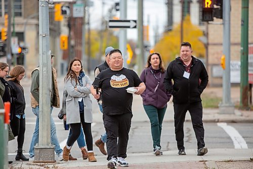 BROOK JONES / WINNIPEG FREE PRESS
Forty-one-year-old Carter Chen leading the Chinatown Dim Sum Tour in Winnipeg, Man., on the afternoon of Saturday, Oct. 21, 2023. Chen, who has his very own Dim Sum T-shirt, is pictured just before arriving at Dim Sum Garden at 245 King St., which was one of two stops on the tour. The other location was Sam Po Restaurant at 277 Rupert Ave. Twenty people attended the tour. 