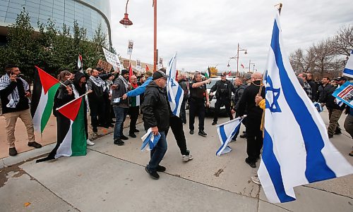JOHN WOODS / WINNIPEG FREE PRESS
Police step in as Israeli supporters retrieve a flag taken by Palestinian supporters as both sides gather outside the Canadian Museum for Human Rights in Winnipeg Tuesday, August  22, 2023. 

Reporter: searle
