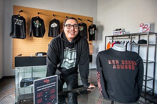 MIKAELA MACKENZIE / WINNIPEG FREE PRESS

Sean Rayland, owner of Red Rebel Armour, at the company&#x2019;s storefront and production space on Century Street on Friday, Oct. 20, 2023. Rayland spent his youth going in and out of prison. Now in his 30s, the father of eight established his clothing business in 2018 after deciding to change the direction of his life. For AV story.
Winnipeg Free Press 2023.