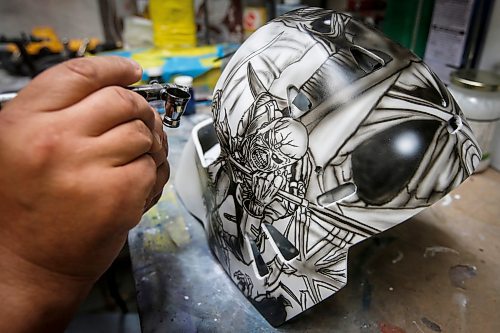 JOHN WOODS / WINNIPEG FREE PRESS
Tony Bage, founder of Wicked Goalie, works on his latest creation in his home studio in Winnipeg Monday, October 23, 2023. Bage has been airbrushing hockey masks and other things like motorcycles for close to 30 years.
Reporter: sanderson