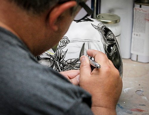 JOHN WOODS / WINNIPEG FREE PRESS
Tony Bage, founder of Wicked Goalie, works on his latest creation in his home studio in Winnipeg Monday, October 23, 2023. Bage has been airbrushing hockey masks and other things like motorcycles for close to 30 years.

Reporter: sanderson
