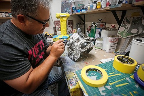 JOHN WOODS / WINNIPEG FREE PRESS
Tony Bage, founder of Wicked Goalie, works on his latest creation in his home studio in Winnipeg Monday, October 23, 2023. Bage has been airbrushing hockey masks and other things like motorcycles for close to 30 years.
Reporter: sanderson