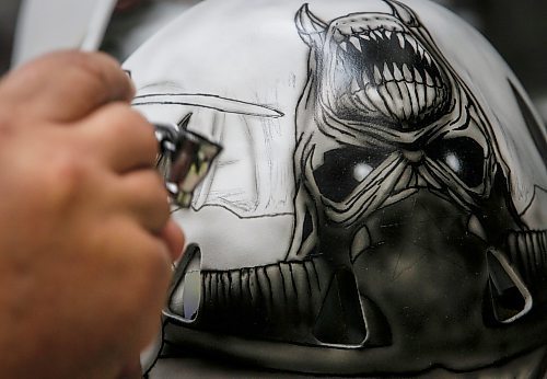 JOHN WOODS / WINNIPEG FREE PRESS
Tony Bage, founder of Wicked Goalie, works on his latest creation in his home studio in Winnipeg Monday, October 23, 2023. Bage has been airbrushing hockey masks and other things like motorcycles for close to 30 years.

Reporter: sanderson