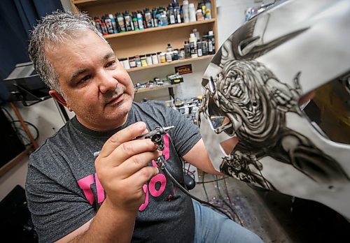 JOHN WOODS / WINNIPEG FREE PRESS
Tony Bage, founder of Wicked Goalie, works on his latest creation in his home studio in Winnipeg Monday, October 23, 2023. Bage has been airbrushing hockey masks and other things like motorcycles for close to 30 years.

Reporter: sanderson