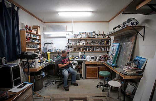 JOHN WOODS / WINNIPEG FREE PRESS
Tony Bage, founder of Wicked Goalie, works on his latest creation in his home studio in Winnipeg Monday, October 23, 2023. Bage has been airbrushing hockey masks and other things like motorcycles for close to 30 years.

Reporter: sanderson