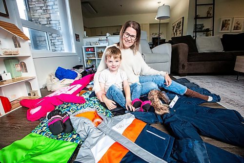 MIKAELA MACKENZIE / WINNIPEG FREE PRESS

Hudson Lylyk, 5, and his mom, mom, Bria Lylyk, with the snow gear Hudson has fundraised to provide for Koats for Kids on Tuesday, Oct. 24, 2023. For Tyler story.
Winnipeg Free Press 2023.