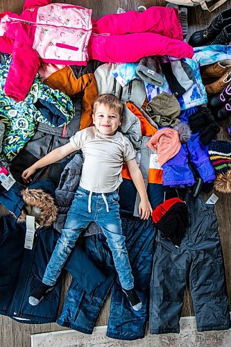 MIKAELA MACKENZIE / WINNIPEG FREE PRESS

Hudson Lylyk, 5, with some of the snow gear he has fundraised to provide for Koats for Kids on Tuesday, Oct. 24, 2023. For Tyler story.
Winnipeg Free Press 2023.