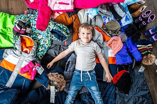 MIKAELA MACKENZIE / WINNIPEG FREE PRESS

Hudson Lylyk, 5, with some of the snow gear he has fundraised to provide for Koats for Kids on Tuesday, Oct. 24, 2023. For Tyler story.
Winnipeg Free Press 2023.