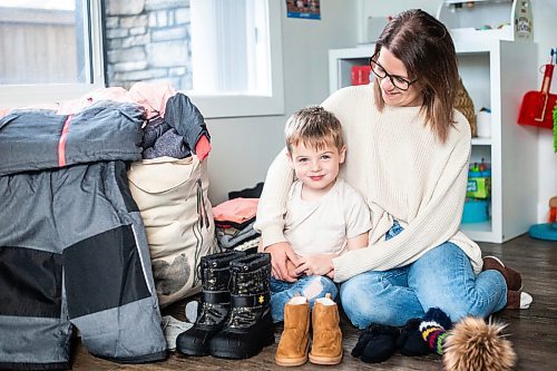 MIKAELA MACKENZIE / WINNIPEG FREE PRESS

Hudson Lylyk, 5, and his mom, mom, Bria Lylyk, with the snow gear Hudson has fundraised to provide for Koats for Kids on Tuesday, Oct. 24, 2023. For Tyler story.
Winnipeg Free Press 2023.