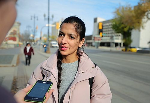 RUTH BONNEVILLE / WINNIPEG FREE PRESS

LOCAL - transit demand

Photo of Jagmeet Kaur answering questions  from a reporter while waiting for her bus near City Hall Tuesday. 

BUS DEMAND: Winnipeg Transit is facing the highest demand it&#x573; seen in years, amid a driver shortage that&#x573; forcing it to operate at five per cent below normal service levels. 

Story by JOYANNE 

October 24th, 2023
