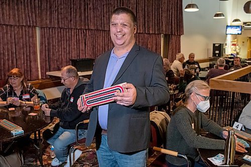 BROOK JONES / WINNIPEG FREE PRESS
Lyndon Demers, who is holding a cribbage board, hosts Lyndon's Cribbage Nights every second Wednesday from 6:30 to 9 p.m. on the second floor of Heather Curling Club at 120 Youville Street. As many as 20 participants gather for the cribbage nights, rotating opponents as the evening goes along. Demers was pictured at the Heather Curling Club in Winnipeg, Man., Wednesday, Oct. 25, 2023.