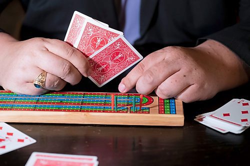 BROOK JONES / WINNIPEG FREE PRESS
Thirty-five-year-old Lyndon Demers, who is passionate about cribbage, showcases a cribbage board as he hosts Lyndon's Cribbage Nights every second Wednesday from 6:30 to 9 p.m. on the second floor of Heather Curling Club at 120 Youville Street. As many as 20 enthusiatic cribbage players gather for the cribbage nights, rotating opponents as the evening goes along. Demers was pictured at the Heather Curling Club in Winnipeg, Man., Wednesday, Oct. 25, 2023.