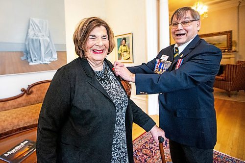 MIKAELA MACKENZIE / WINNIPEG FREE PRESS

Lieutenant Governor Anita R. Neville is presented with the first poppy of this year&#x2019;s annual Royal Canadian Legion fundraiser by Comrade Ernie Tester, president of the Royal Canadian Legion Provincial Command, at Government House on Thursday, Oct. 26, 2023. The legion&#x2019;s poppy campaign always begins on the last Friday of October, and the poppy blossoms on the lapels and collars of more than 19 million Canadians.
Winnipeg Free Press 2023.