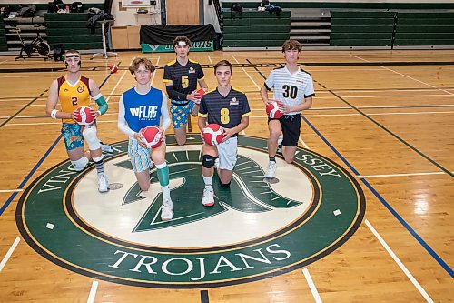 BROOK JONES / WINNIPEG FREE PRESS
The Institut Coll&#xe9;gial Vincent Massey Collegaite Trojans varsity boys volleyball team is undefeated as of Oct. 26. Pictured left to right: Grade 12 players Morgan Eby, Keon Torz, Everett Smith, Mitchell Strilchuk and Shay McKim holding volleyballs during a team practice at the school's gym in Winnipeg, Man., Thursday, Oct. 26. 2023. Missing: Grade 12 player Owen Weekes.