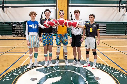 BROOK JONES / WINNIPEG FREE PRESS
The Institut Coll&#xe9;gial Vincent Massey Collegaite Trojans varsity boys volleyball team is undefeated as of Oct. 26. Pictured left to right: Grade 12 players Morgan Eby, Keon Torz, Everett Smith, Mitchell Strilchuk and Shay McKim holding volleyballs during a team practice at the school's gym in Winnipeg, Man., Thursday, Oct. 26. 2023. Missing: Grade 12 player Owen Weekes.