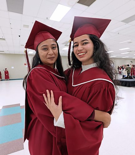 Assiniboine Community College students Himani Himani, left, and Harnoor Brar hug for a picture shortly before their graduation ceremony on Friday afternoon at the Keystone Centre's Manitoba Room. The two women earned an advanced diploma in Sustainable Food Systems from the college. (Matt Goerzen/The Brandon Sun)