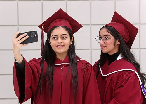 Assiniboine Community College students Gilmore Kaur and Mehakdeep Kaur pose for a selfie shortly before their graduation ceremony at the Keystone Centre's Manitoba Room on Friday afternoon. Both students graduated from ACC's Health Care Aide program. (Matt Goerzen/The Brandon Sun)