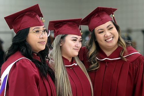 Assiniboine Community College students Jasmine Maglian, from left, Jodi Cosino and Khrizianne Gaffud, part of the LPN program at ACC's Winnipeg campus, pose for a photo shortly before their graduation ceremony at the Keystone Centre's Manitoba Room on Friday afternoon. (Matt Goerzen/The Brandon Sun) 