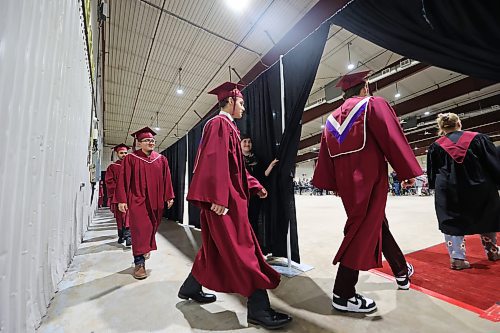 Students with Assiniboine Community College walk into the Manitoba Room at the Keystone Centre at the start of their graduation ceremony on Friday afternoon. (Matt Goerzen/The Brandon Sun)